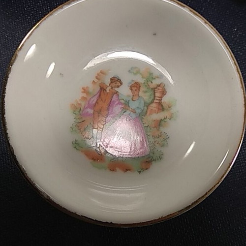 Set of 3 porcelain miniature plates used with romantic designs