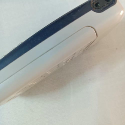 Alcatel mobile phone used, non-functional, with original charger
