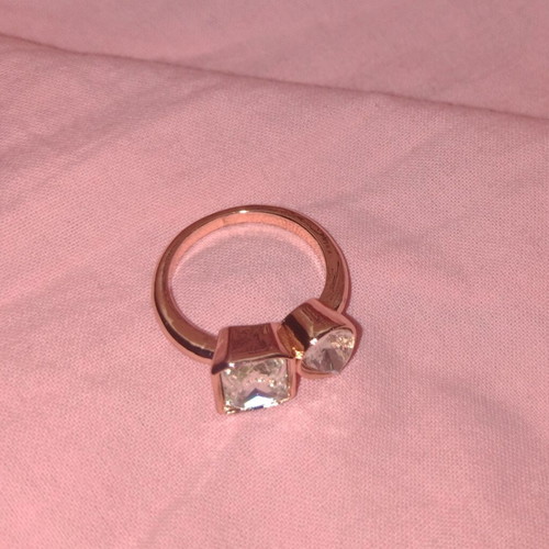 Rose gold ring with faceted rectangular and round stones