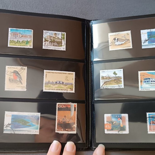 Stamp album with 120 stamps like new, Greece Australia Cyprus Germany America Canada