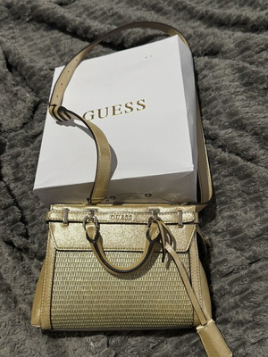 Guess gold shoulder bag with woven front design