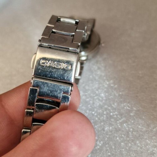 Casio women's watch used with black dial and metal bracelet
