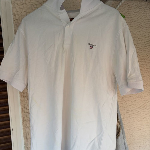Two white polo shirts used, size XL, slight yellow stain on one