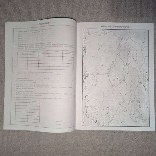 School atlas with exercises used for sixth grade