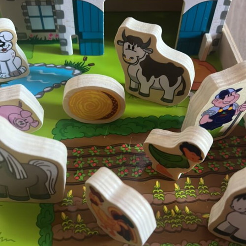 Wooden farm playset with 31 pieces in like new condition
