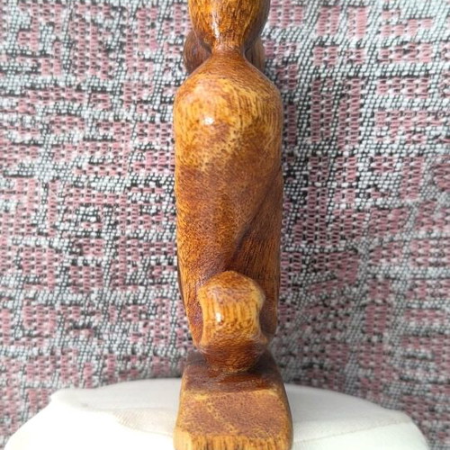 Wooden sculpture embrace like new, natural material decoration