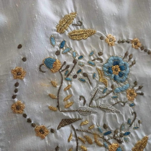 Handmade tsevres with handmade lace, slight wear