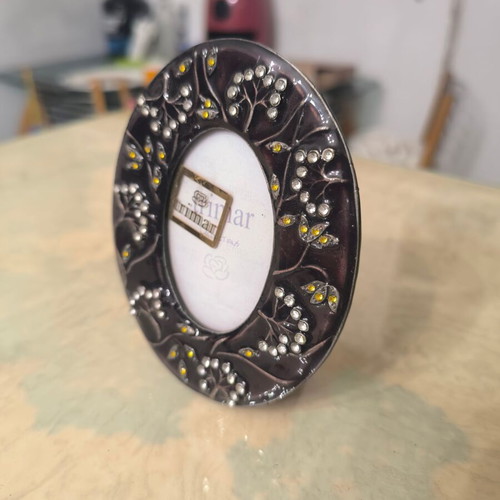 Round photo frame like new with colorful decorative patterns