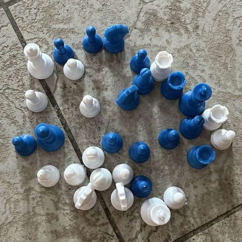 Vintage blue and white plastic chess pieces set