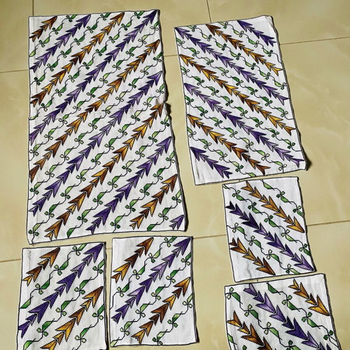 Set of handmade embroidered table linens used, counted pieces