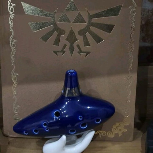 Zelda Twilight Princess statues new with strategy guide and ocarina