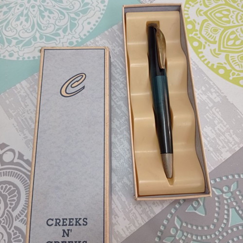 Creeks n Creeks bronze and green pen in good condition