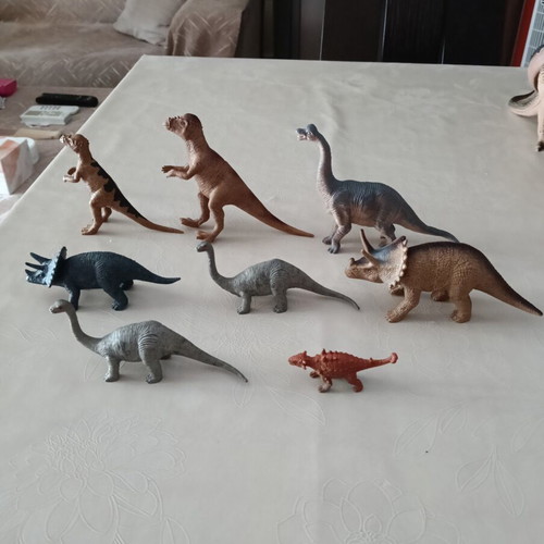 Set of 24 dinosaur figures in various sizes