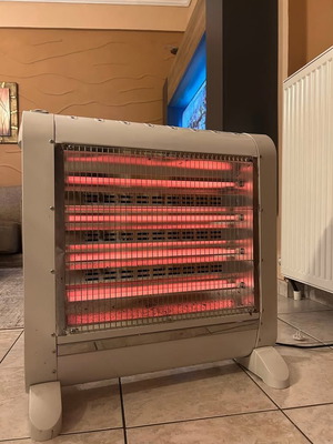 Quartz heater like new with water container
