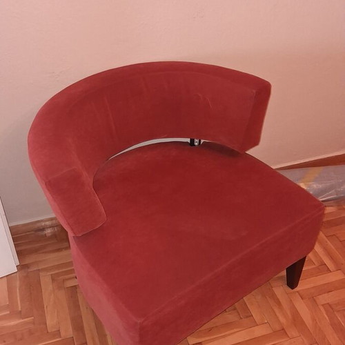 Modern burgundy fabric armchair with wooden legs