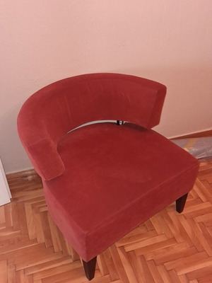 Modern burgundy fabric armchair with wooden legs