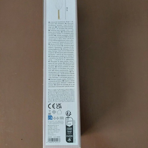 Head massager new, opened for battery placement