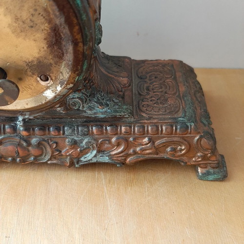 Copper German wind-up clock used with cathedral motif