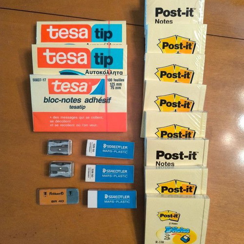 Office supplies new with sticky notes, erasers and sharpeners