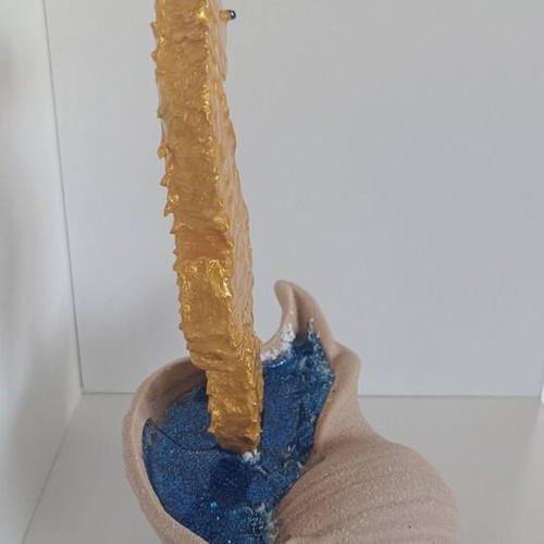 Handmade decorative gold seahorse from clay and resin with brown shell base