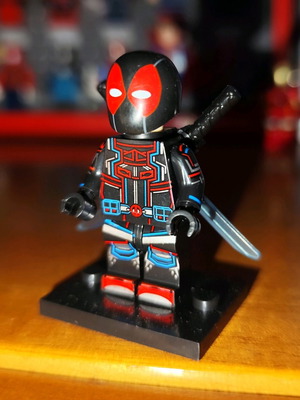 Deadpool (Tron Suit) like new with stand and back sheath