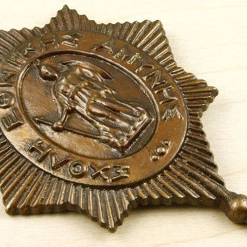Metal emblem of National Defense School used