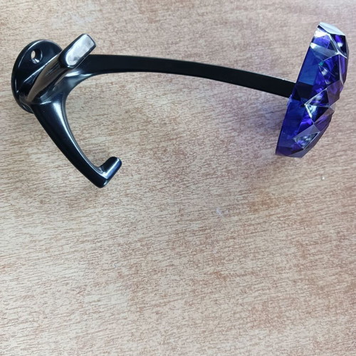 Decorative blue hook with glass-like plastic and metal base