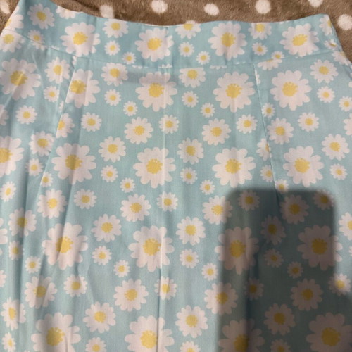 Mini skirt with daisies on blue background, size S, like new