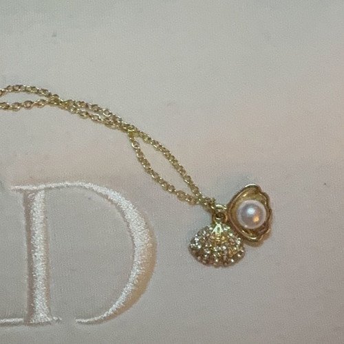 Shell necklace in gold color, new