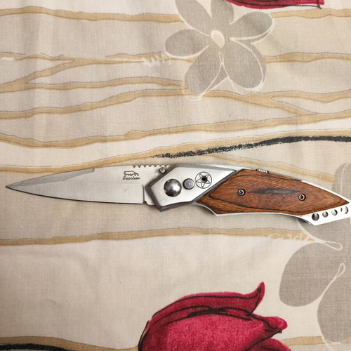 Decorative steel knife like new with button and safety lock