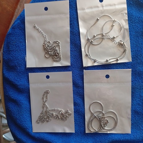 Stainless steel chains set of four new