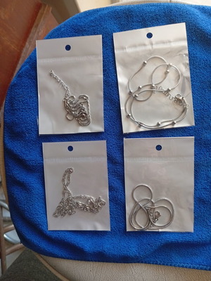 Stainless steel chains set of four new