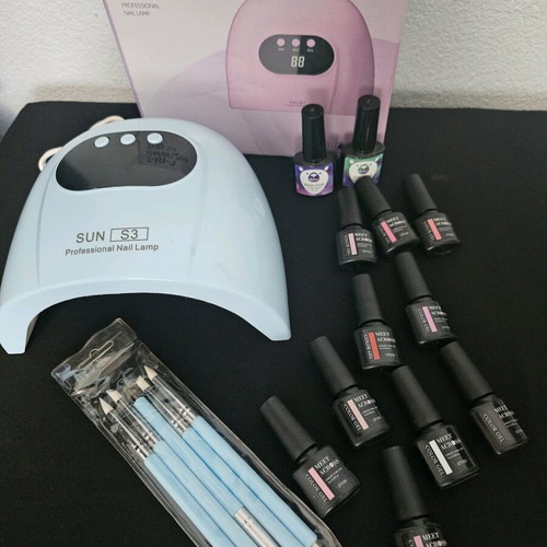 UV LED nail lamp with display like new with gel polishes and tools