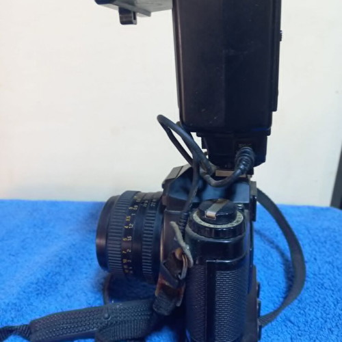 Revueflex AC2 35mm SLR film camera used with Sunpak Auto 26 DX flash