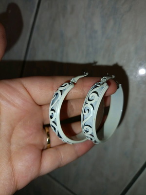 Vintage handmade white hoop earrings with carved designs like new