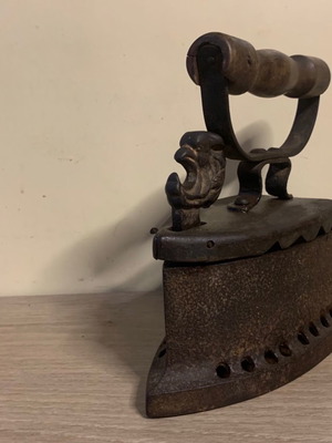 Vintage coal iron used with bird decoration