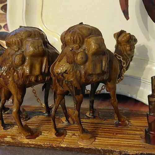 Decorative item used with camels and palm tree made of wood and plastic