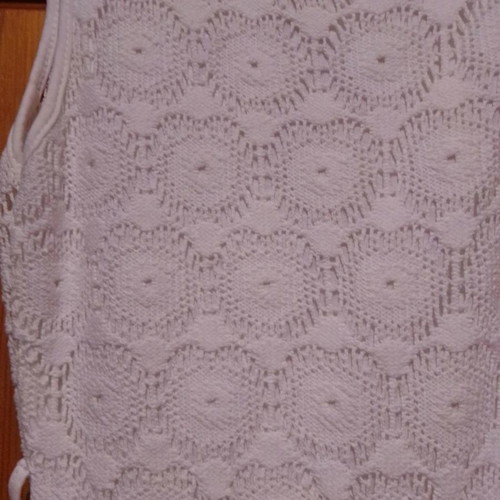 Two white dresses used, sizes 12-14 for girls