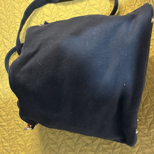 Black shoulder bag with studs used, spacious red lining