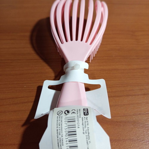 Pink detangling hair comb