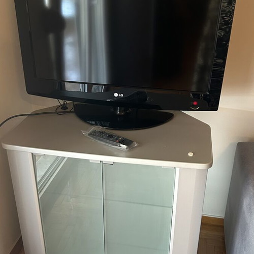 TV cabinet with LG TV, white, glass doors and shelves