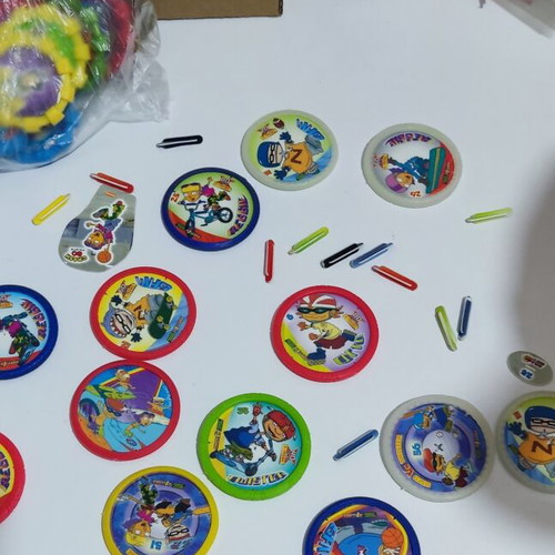Various Pokémon and other collectible pogs