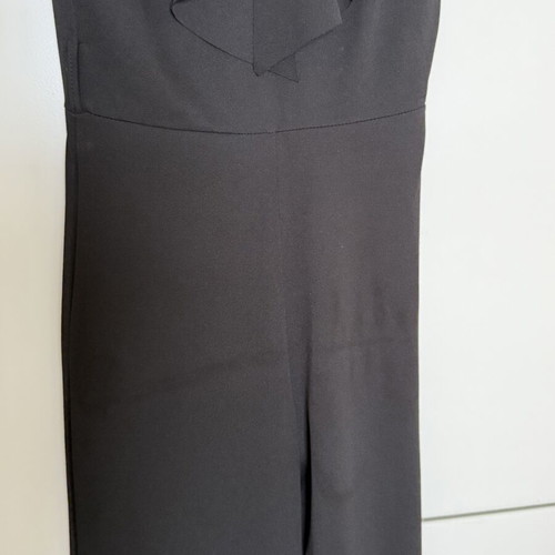 Jumpsuit with ruffles one size like new, black