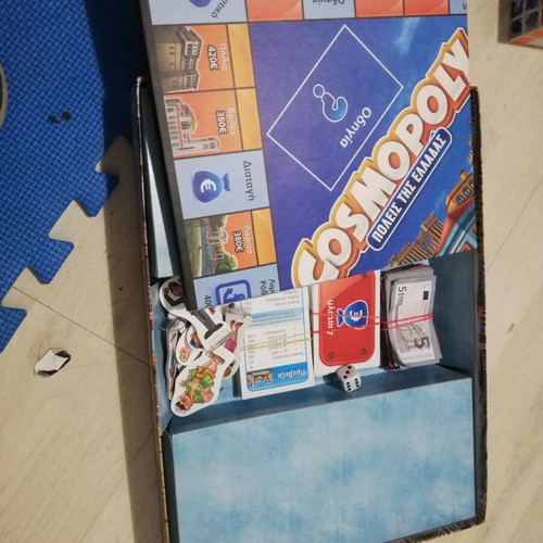 Cosmopoly board game used, missing one die and a pawn base