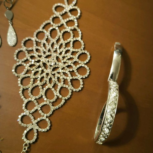 Jewelry set used with earrings, bracelets, pendants, brooch, and watches