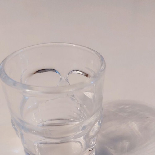 Collectible glass shot glass with 3D skull design like new