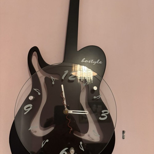 Guitar-shaped wall clock like new