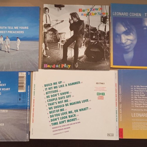 Booklets from Leonard Cohen, Huey Lewis, Manic Street Preachers used, rock