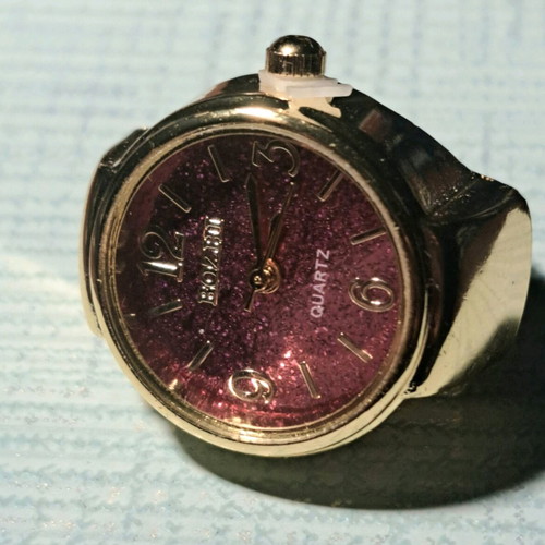 Quartz ring watch like new with purple dial and gold bracelet