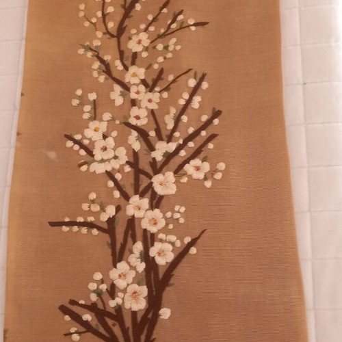 Vintage handmade embroidery with embossed almond blossom design